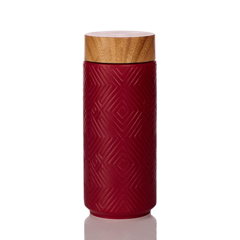 The Miracle Ceramic Tumbler showcasing its elegant design with a bamboo effect lid, featuring a tourmaline lining for enhanced beverage purity.