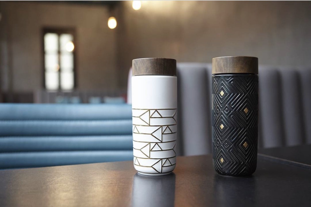 The Miracle Gold Ceramic Tumbler featuring a gold ceramic finish, walnut wood effect lid, and double wall insulation for optimal temperature retention.