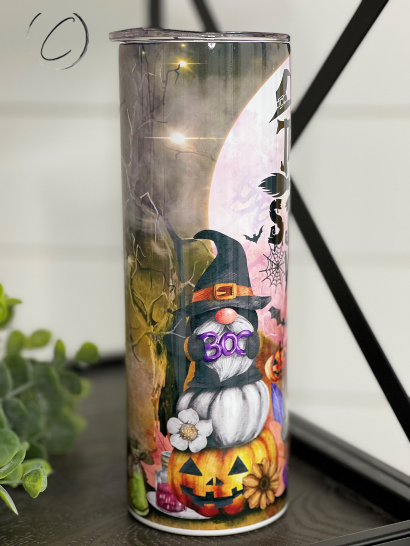 A stylish 20oz skinny tumbler featuring a vibrant design with the phrase 'Thick Thighs & Spooky Vibes', perfect for Halloween and everyday use.