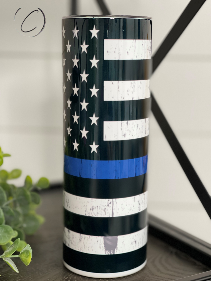 Thin Blue Line 20oz Skinny Tumbler showcasing a full wrap design with a reusable straw, perfect for hot and cold beverages.