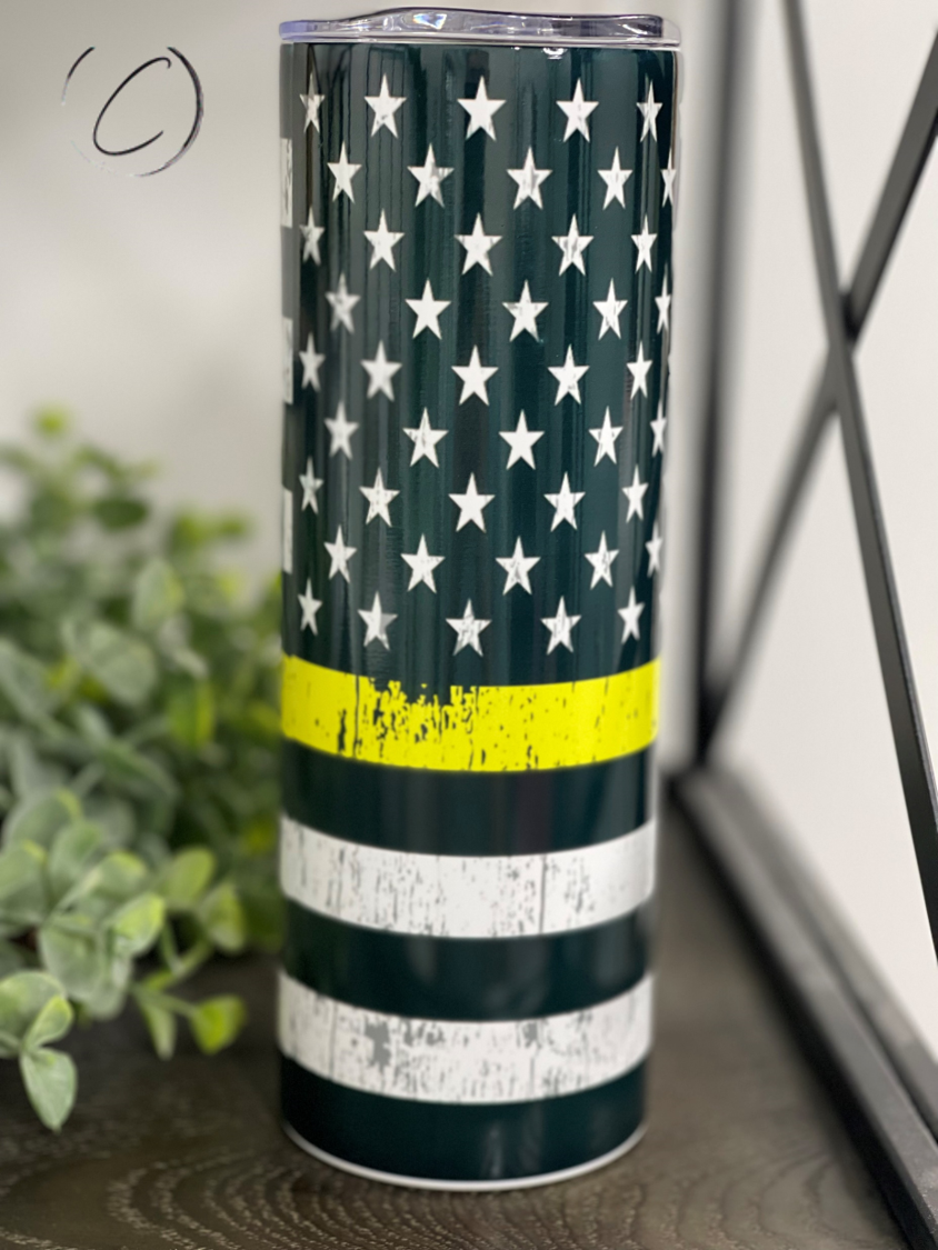 THIN YELLOW LINE 20OZ TUMBLER featuring a full wrap design, durable material, and a reusable straw.