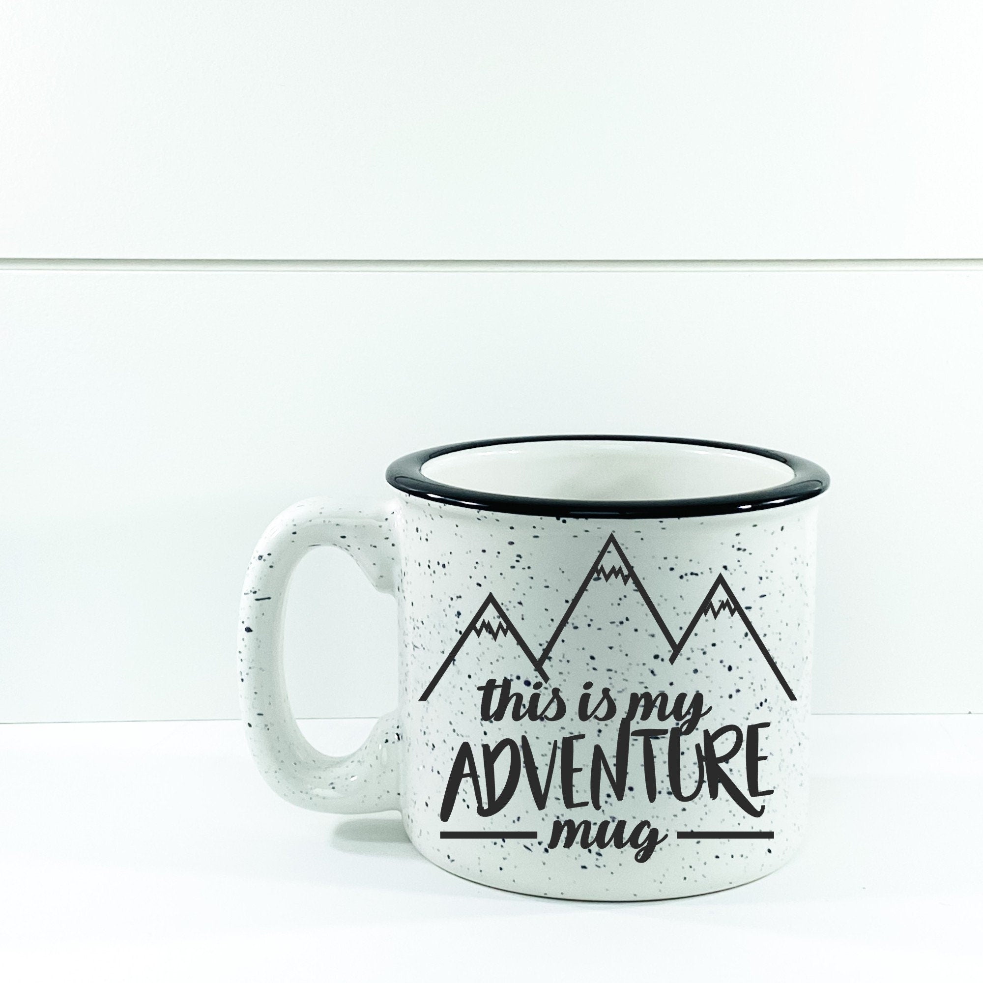 This Is My Adventure Campfire Mug with a unique outdoor design, perfect for enjoying beverages outdoors.