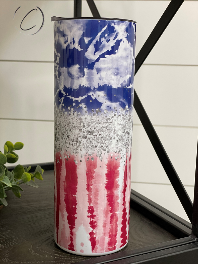 Colorful Tie Dye Flag 20oz Skinny Tumbler with reusable straw, showcasing a vibrant design.