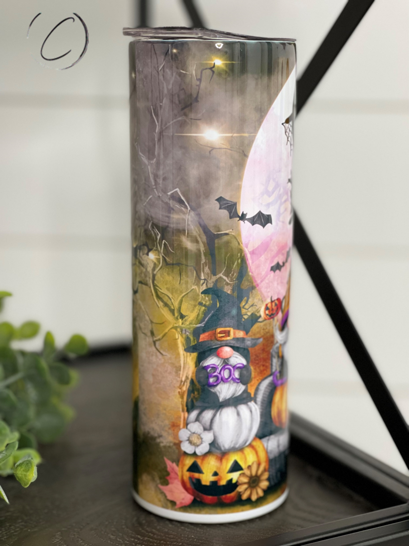 Trick Or Treat Gnomes 20oz Skinny Tumbler featuring vibrant gnome design, reusable straw, and durable construction.