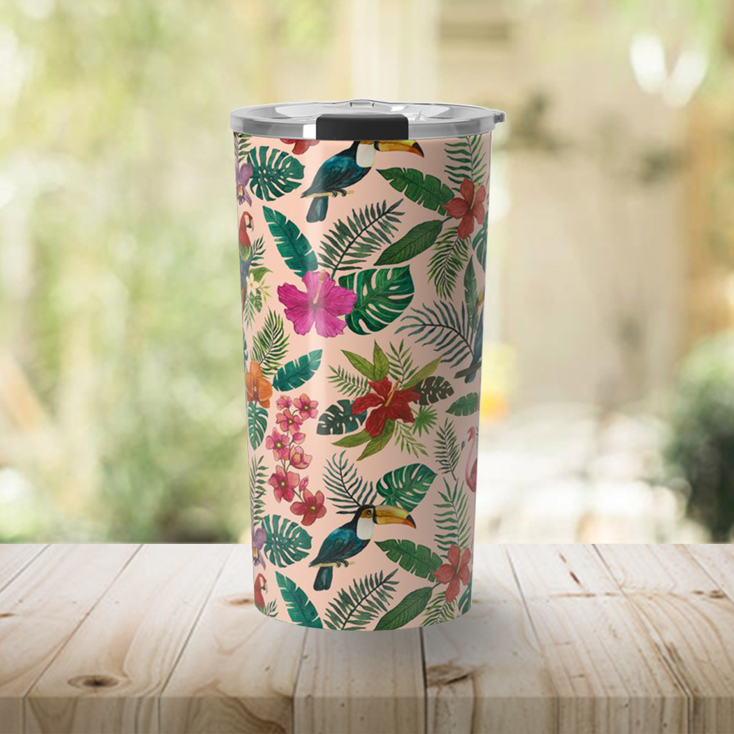 A vibrant Tropical Bird Travel Mug made of stainless steel, featuring colorful wraparound artwork and a vacuum-sealed lid.