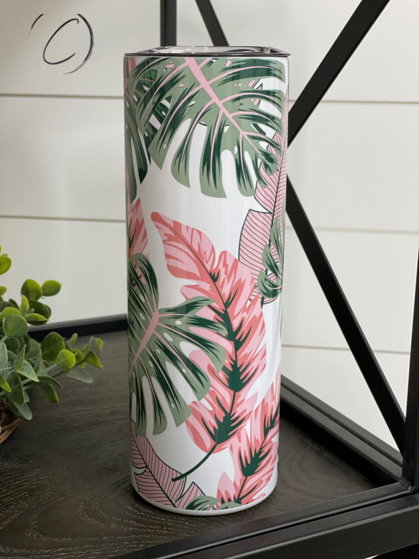 Tropical Blush 20oz Skinny Tumbler with vibrant tropical design and reusable straw.