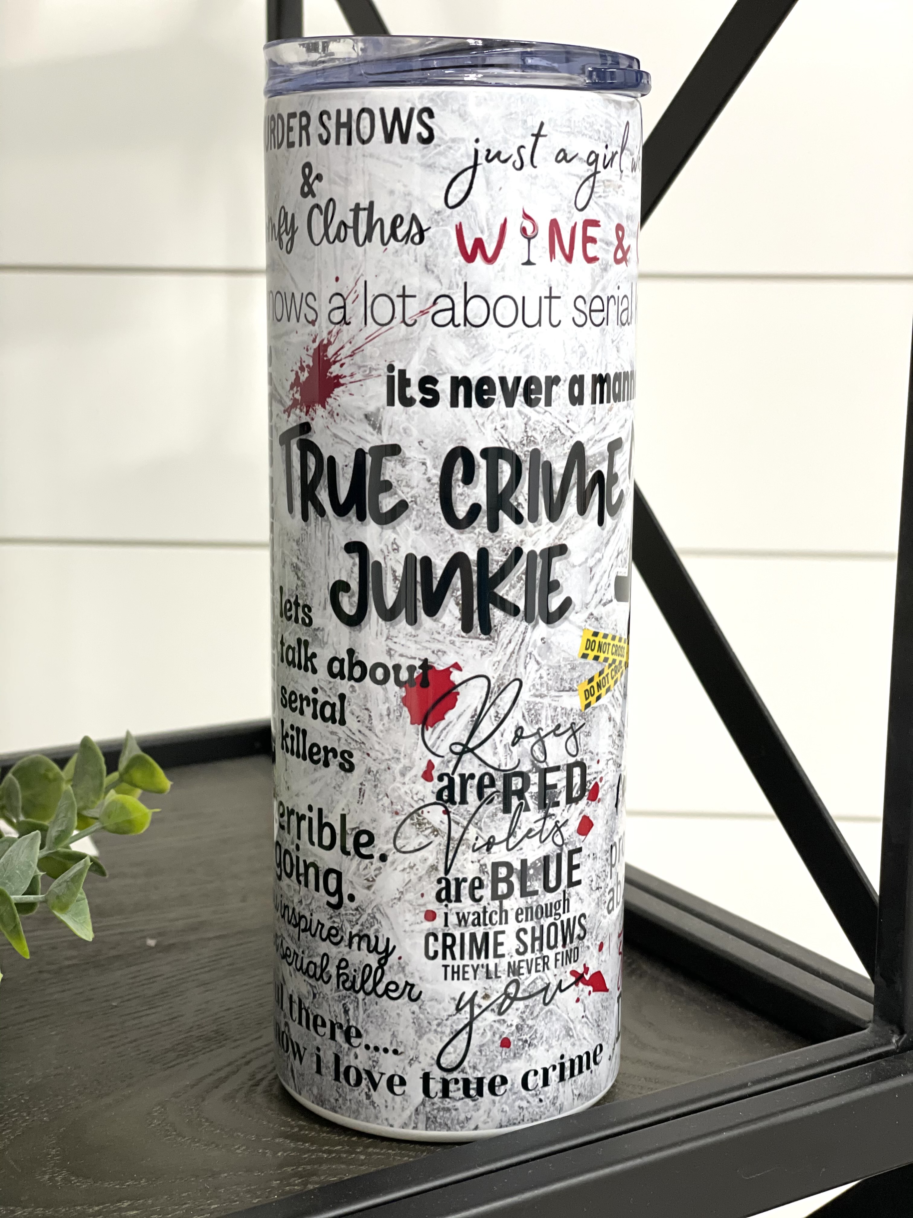 True Crime Junkie 20oz Skinny Tumbler with a stylish design, perfect for true crime enthusiasts.