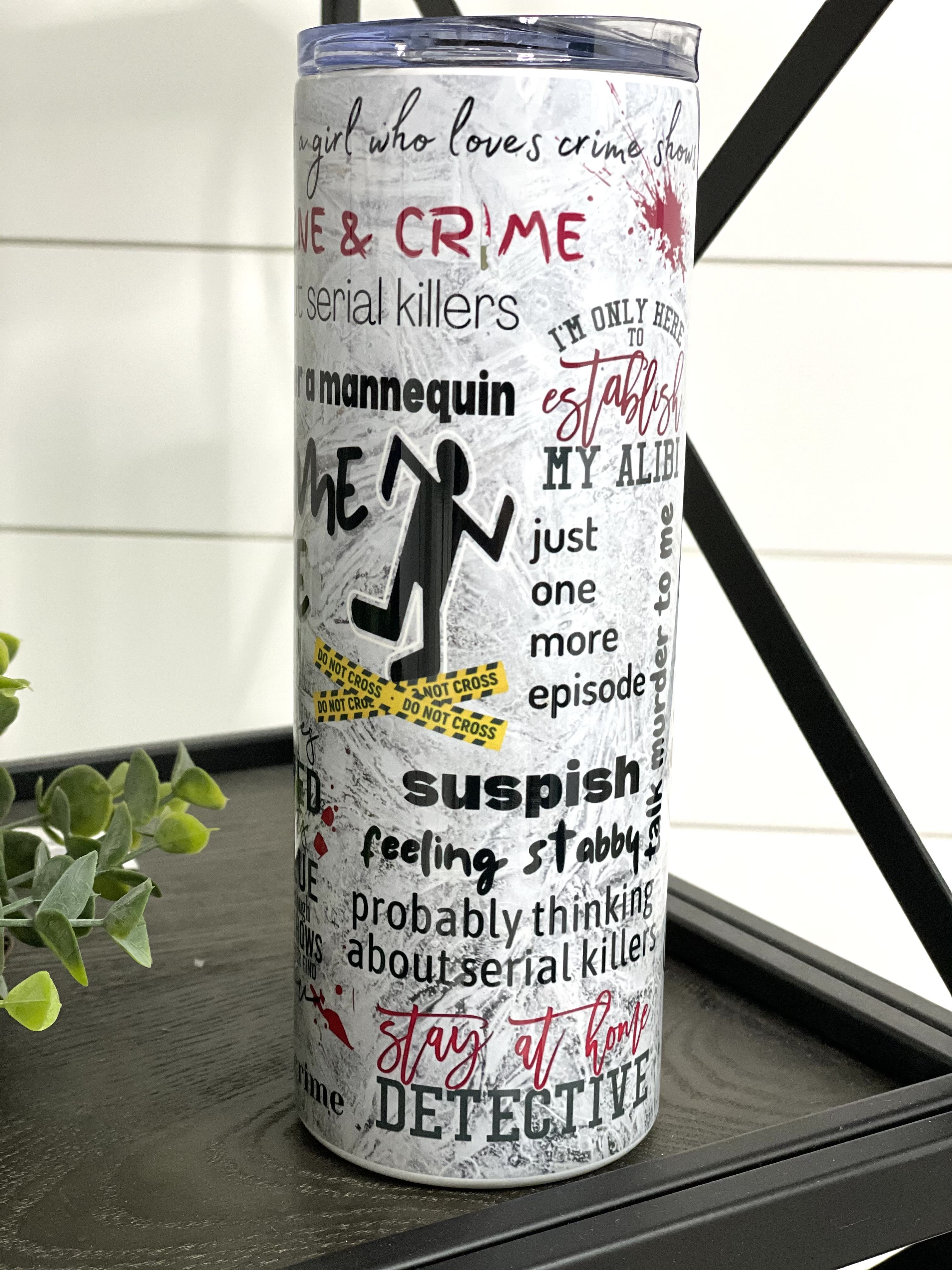 True Crime Junkie 20oz Skinny Tumbler with a stylish design, perfect for true crime enthusiasts.