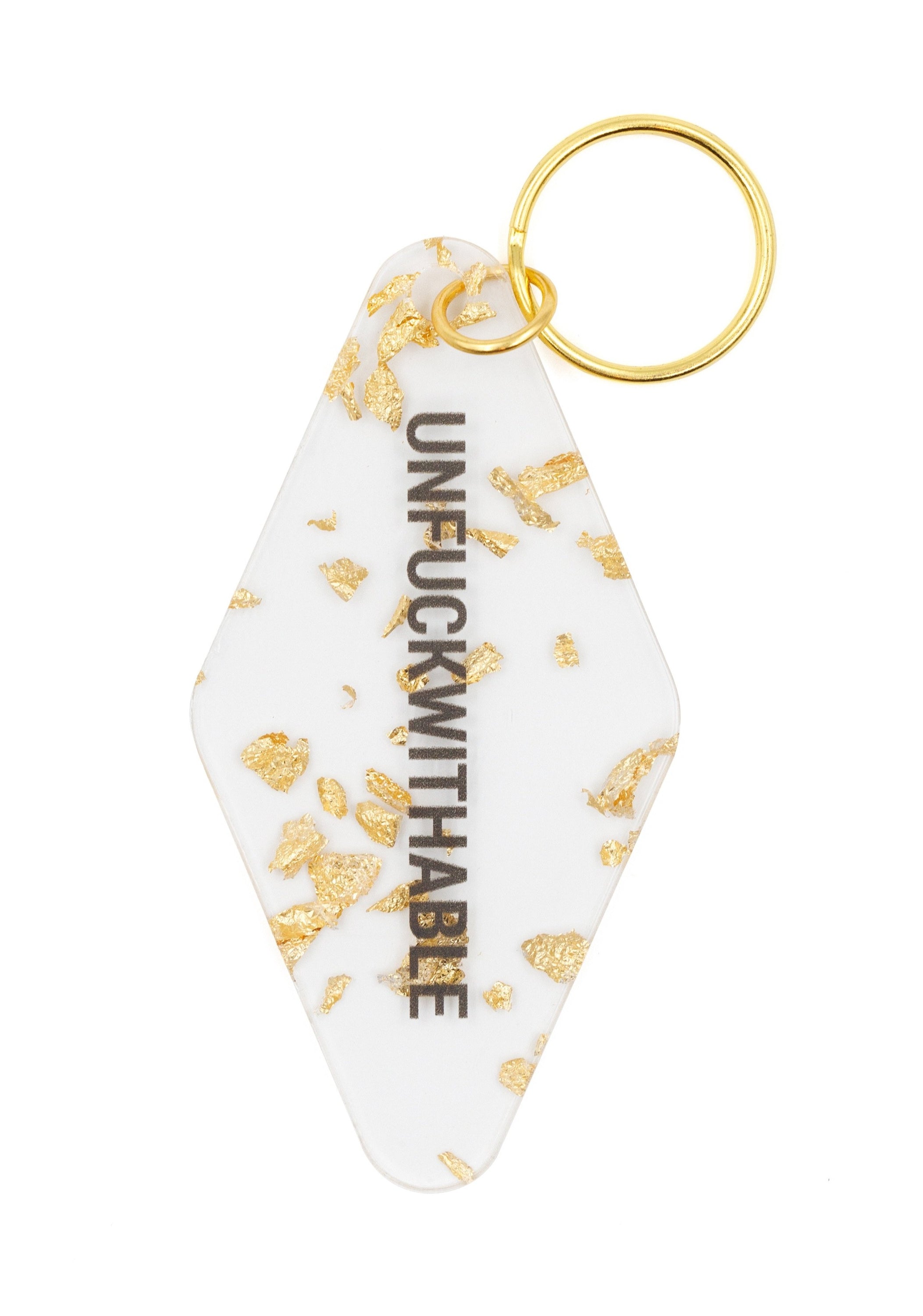 Clear keychain with gold leaf accents and gold hardware, featuring the text 'UNFUCKWITHABLE'.