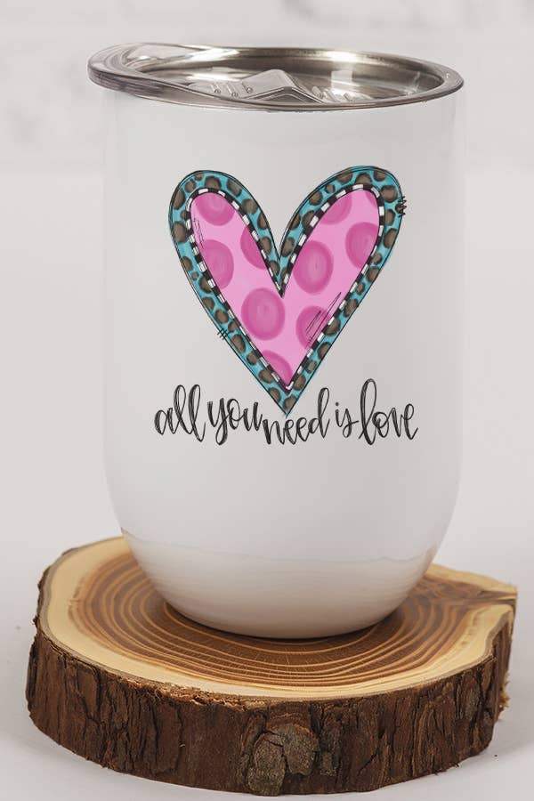 A stylish 12 oz stainless steel wine tumbler with a heart design, featuring a lid and plastic straw, perfect for Valentine's Day gifts.