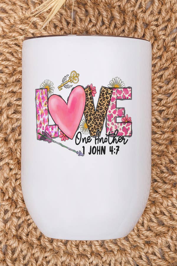 A stylish 12 oz stainless steel wine tumbler with a Valentine's Day design, featuring a lid and plastic straw, perfect for gifting.