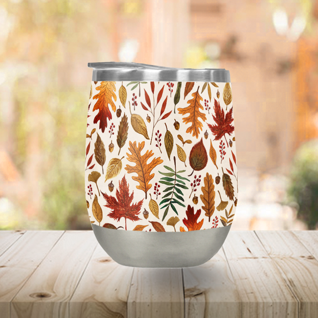 A stylish Watercolor Fall Leaves Stemless Wine Tumbler featuring a vibrant fall leaves design, perfect for outdoor use.