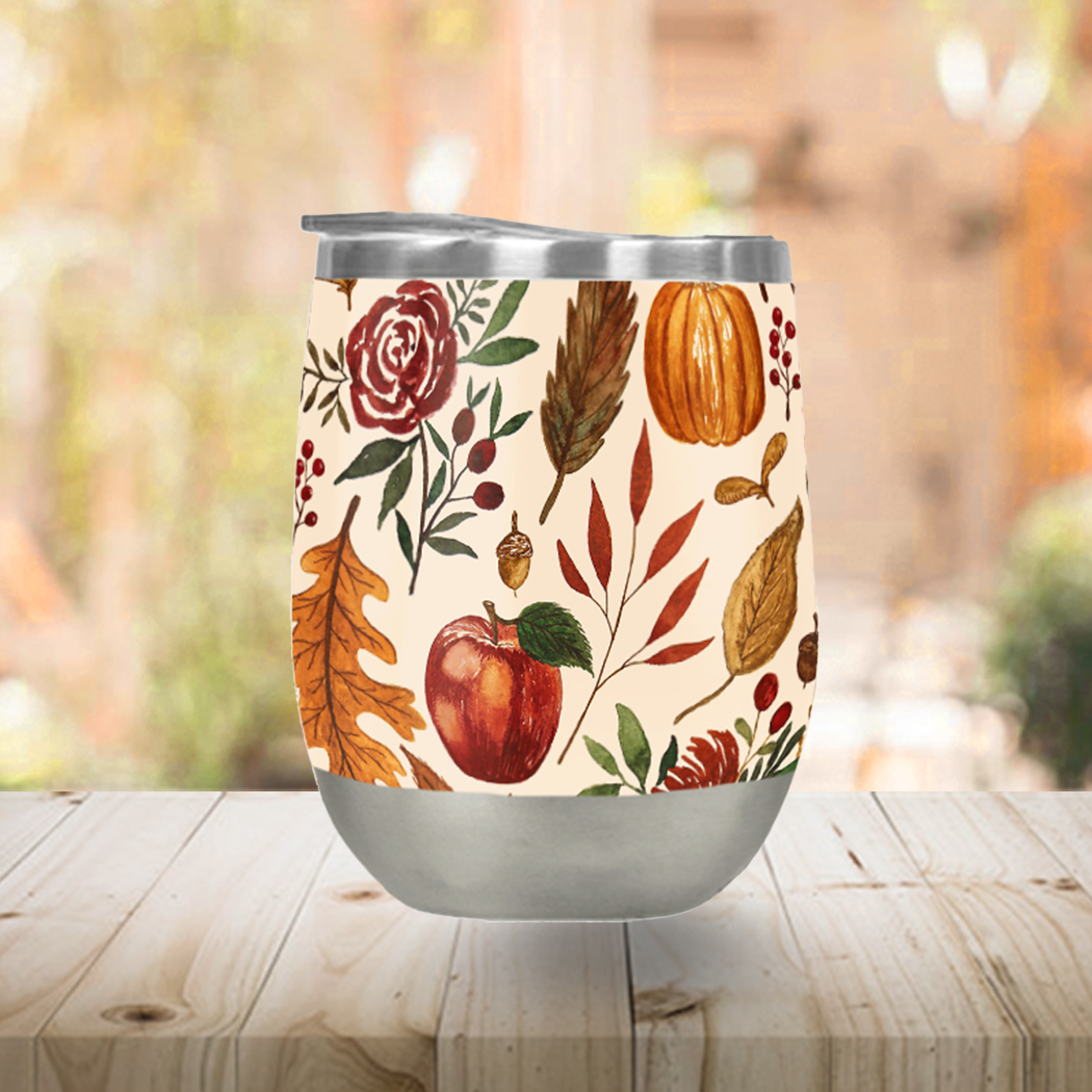 Watercolor Floral Pumpkin Stemless Wine Tumbler featuring vibrant floral designs and a secure lid, perfect for outdoor use.