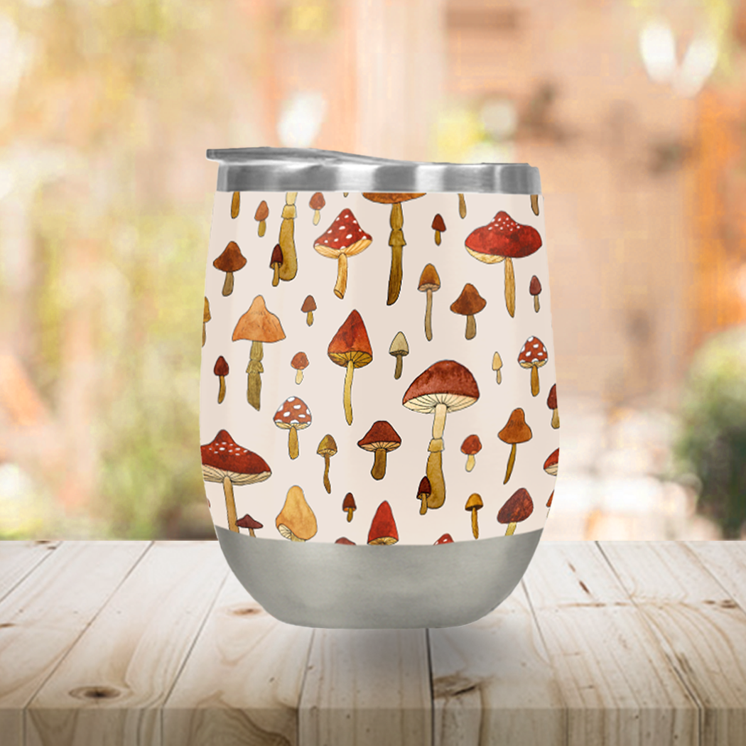 A stylish Watercolor Mushroom Stemless Wine Tumbler featuring a vibrant mushroom design, perfect for outdoor use.