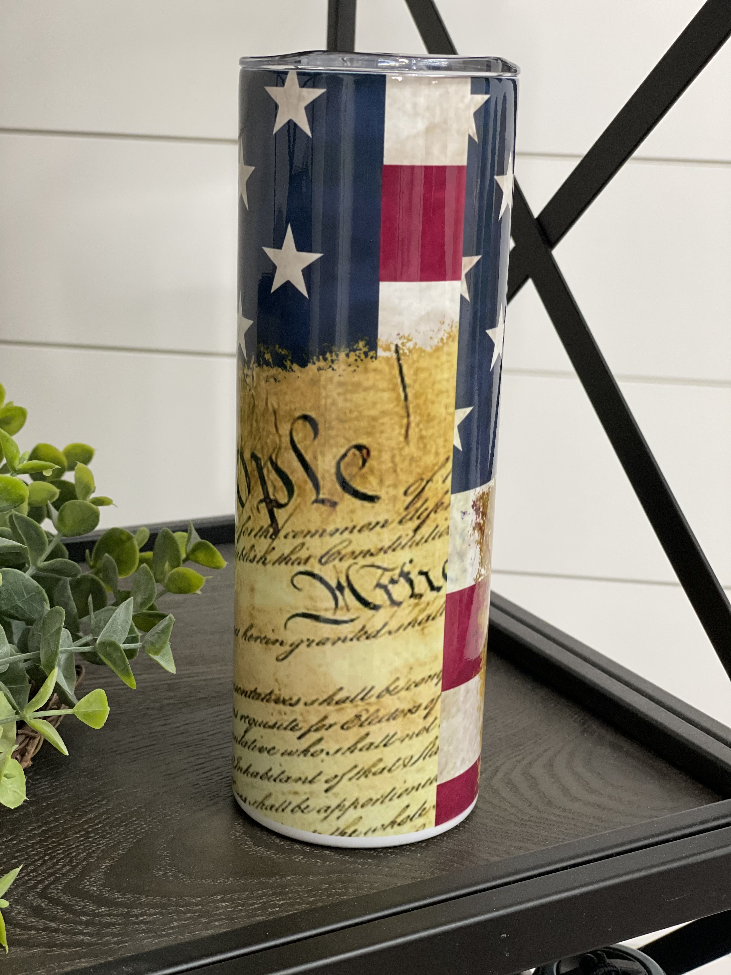 We The People 20oz Skinny Tumbler with a full wrap design, featuring a reusable straw and high-quality finish.