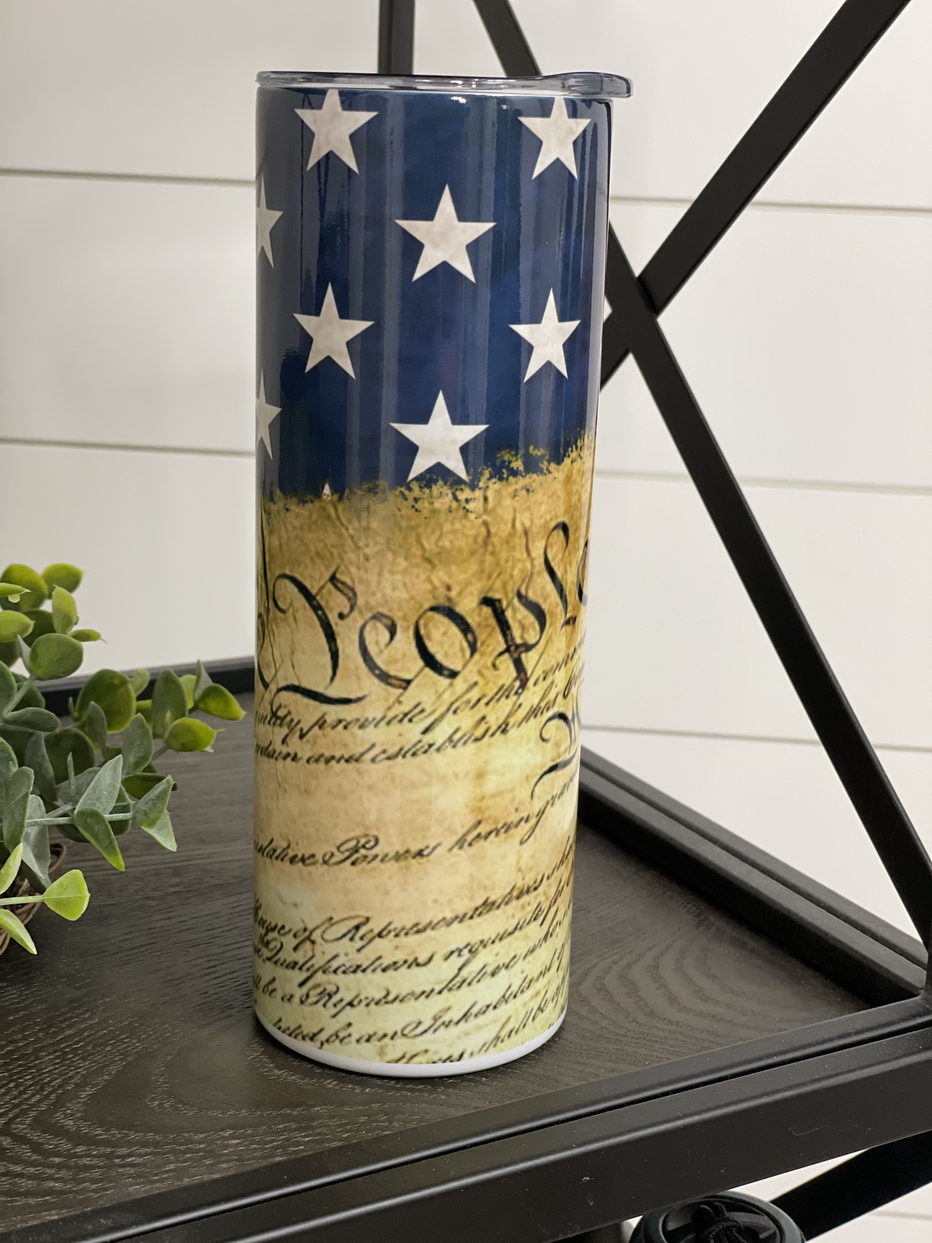 We The People 20oz Skinny Tumbler with a full wrap design, featuring a reusable straw and high-quality finish.