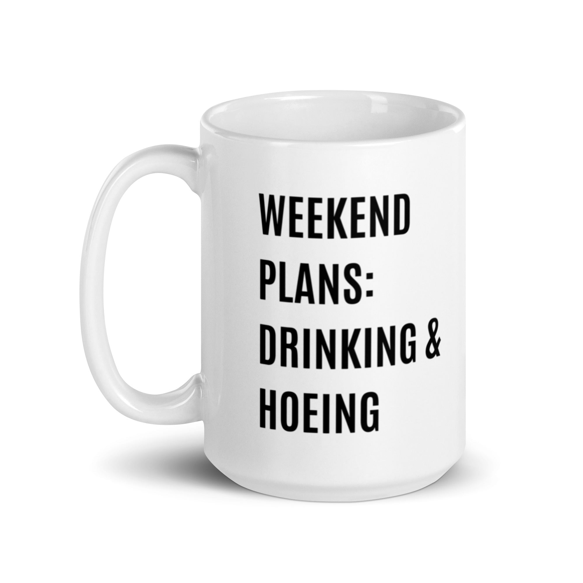 Ceramic mug with a humorous design featuring 'Weekend Plans Drinking & Hoeing', available in two sizes.