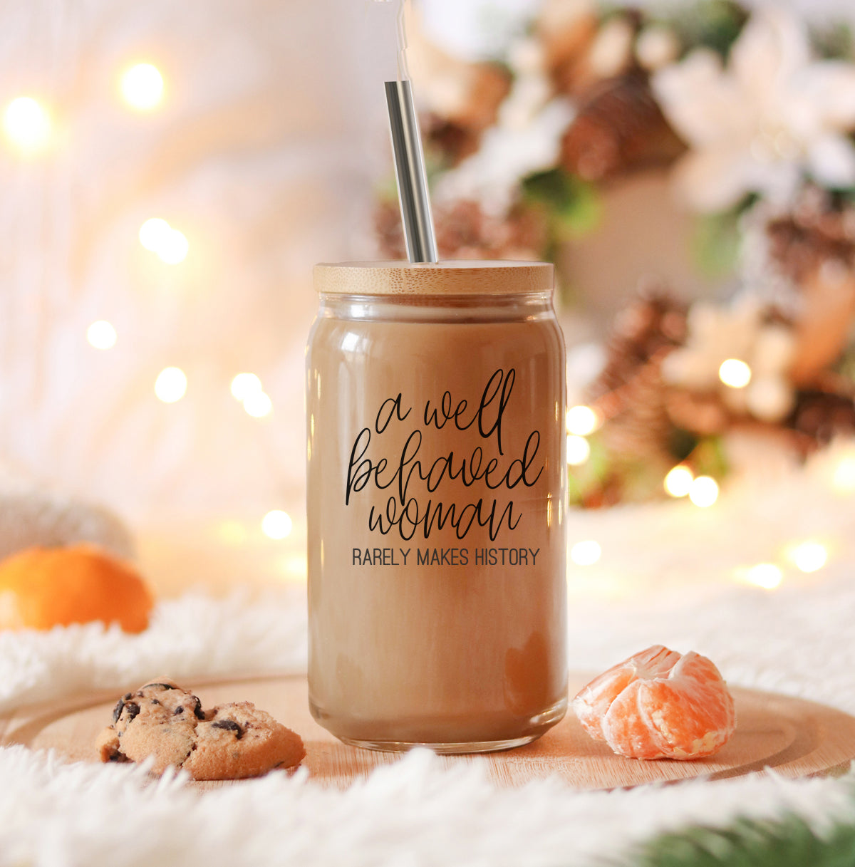 Well Behaved Woman Glass Cup with bamboo lid and stainless steel straws, showcasing a stylish black graphic design.