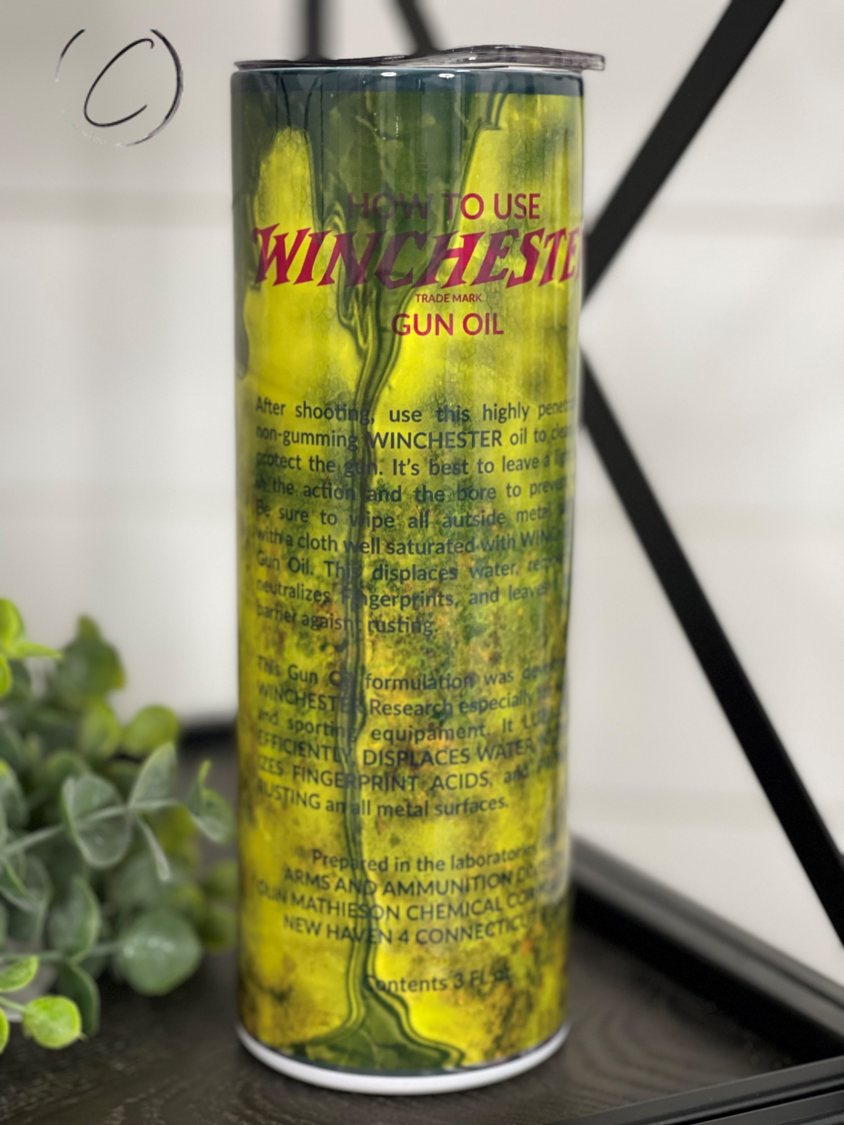 Winchester Gun Oil 20oz Skinny Tumbler with a full wrap design, featuring a durable construction and a reusable straw.