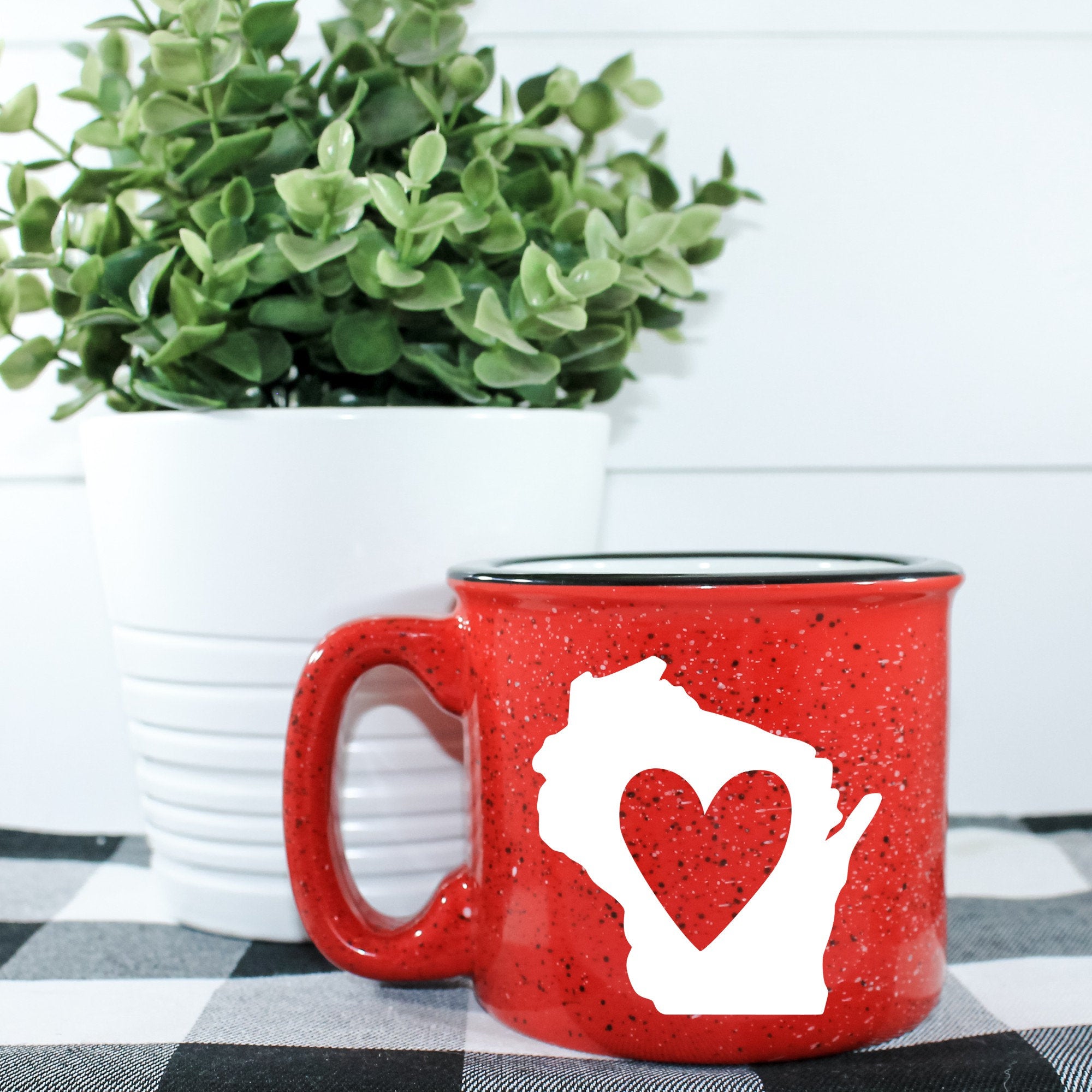 Wisconsin Campfire Mug, a 15 oz ceramic mug with a unique design, perfect for outdoor use and cozy beverages.