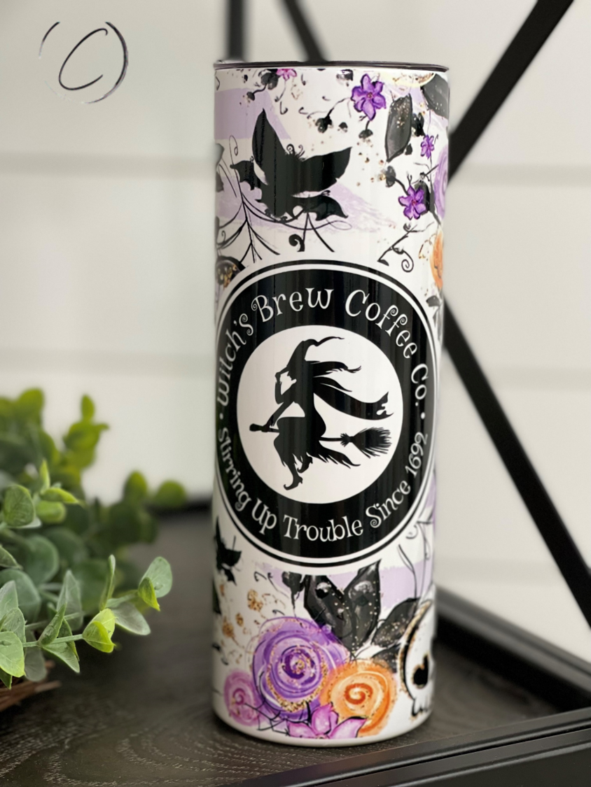 Witches Brew 20oz UV Purple Skinny Tumbler with color-changing effect in sunlight, featuring a unique design and reusable straw.