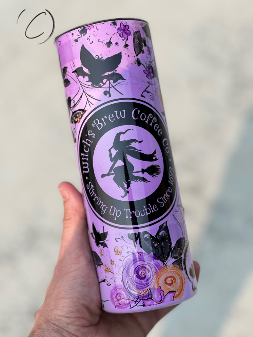 Witches Brew 20oz UV Purple Skinny Tumbler with color-changing effect in sunlight, featuring a unique design and reusable straw.