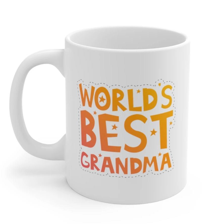 A white ceramic mug with the text 'World's Best Grandma' printed on it, featuring a classic rounded design and a comfortable C-handle.