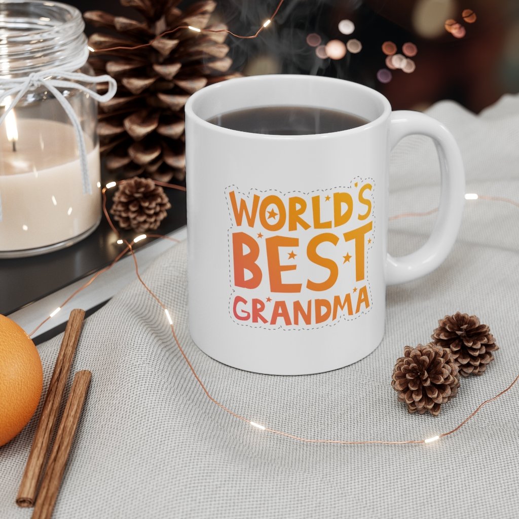 A white ceramic mug with the text 'World's Best Grandma' printed on it, featuring a classic rounded design and a comfortable C-handle.