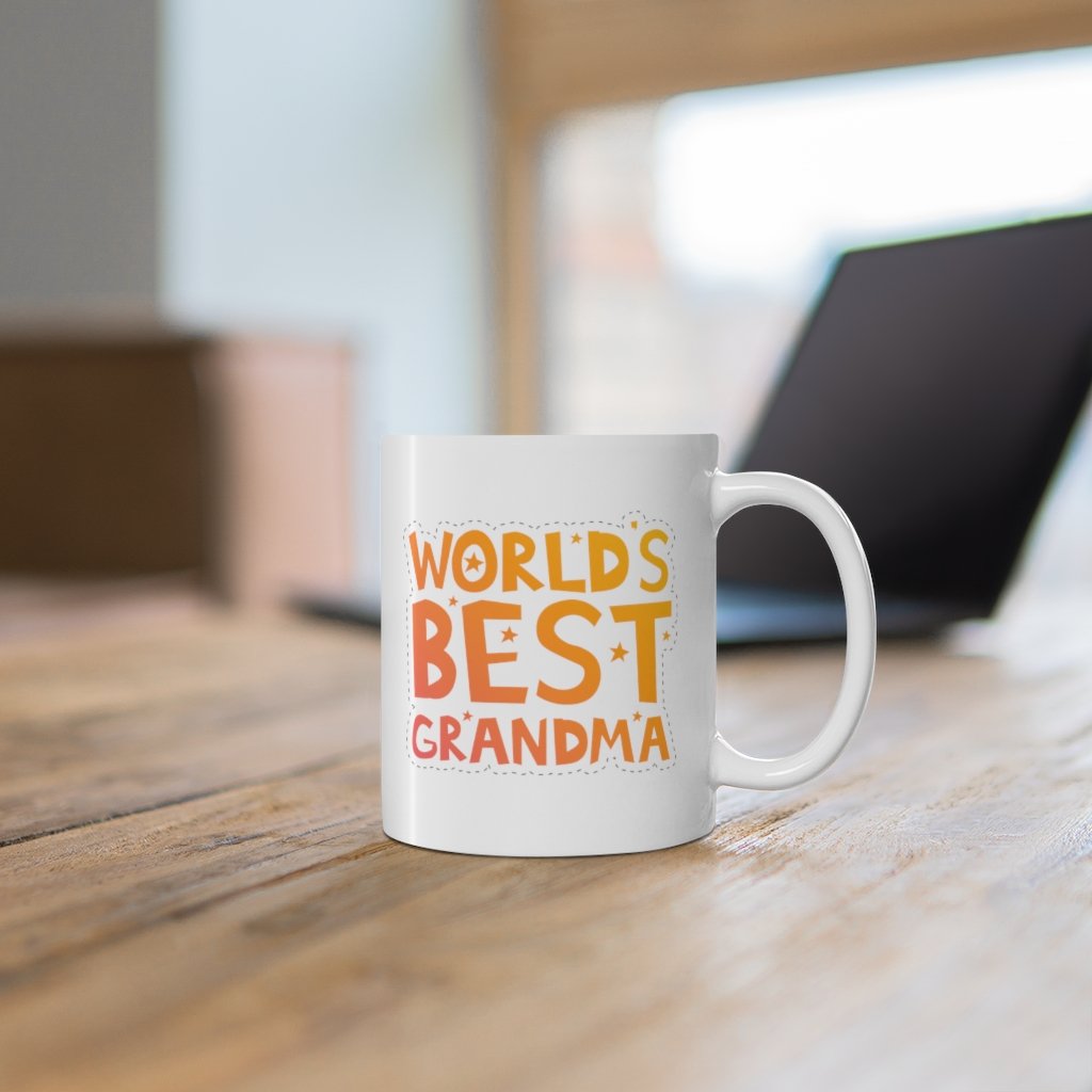 A white ceramic mug with the text 'World's Best Grandma' printed on it, featuring a classic rounded design and a comfortable C-handle.