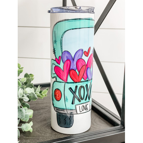 XOXO Truck 20oz Skinny Tumbler with a vibrant design, perfect for hot and cold beverages, includes a reusable straw.