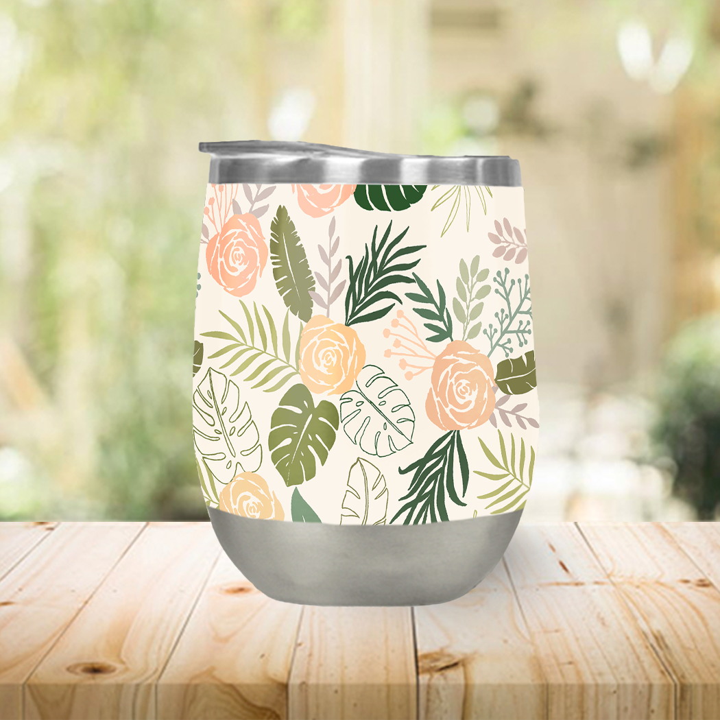 Yellow and green tropical floral stemless wine tumbler with a stylish design, perfect for summer drinks.