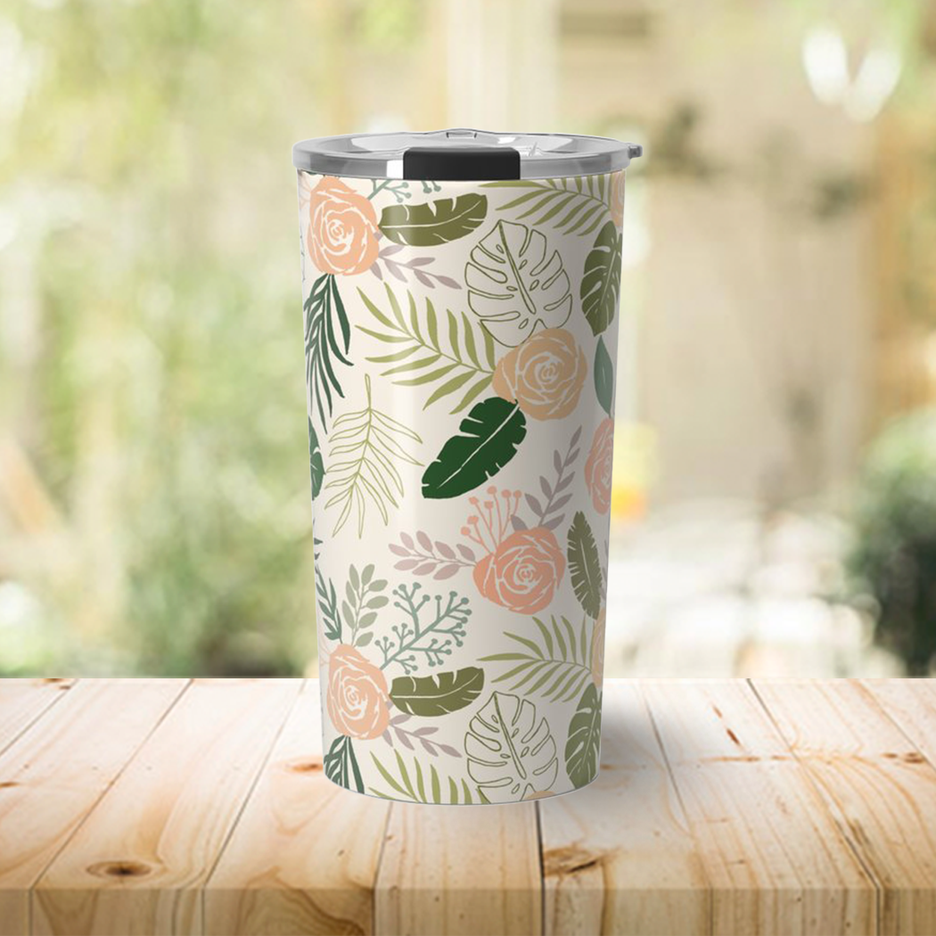 Yellow and green tropical floral travel coffee mug with stainless steel body and vacuum-sealed lid, perfect for hot or cold beverages.