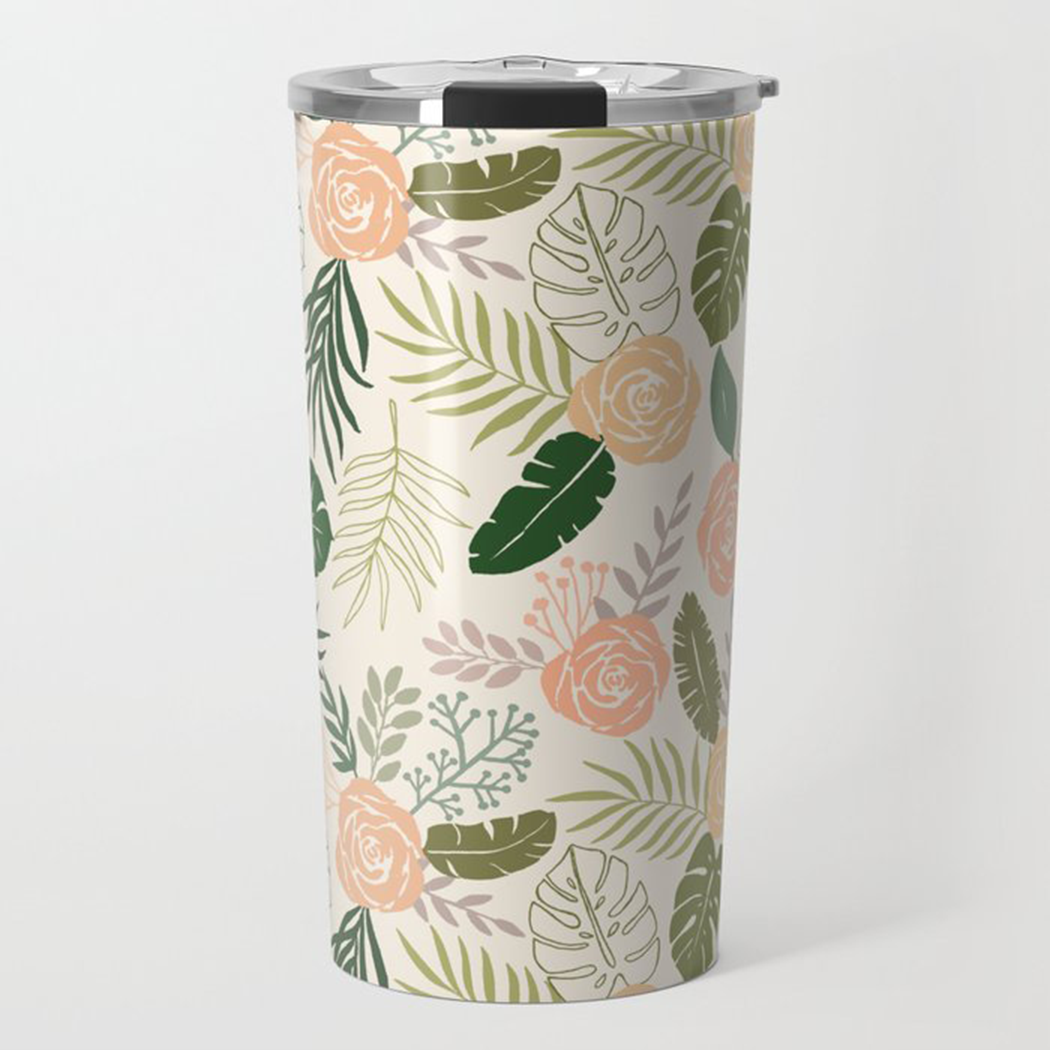 Yellow and green tropical floral travel coffee mug with stainless steel body and vacuum-sealed lid, perfect for hot or cold beverages.