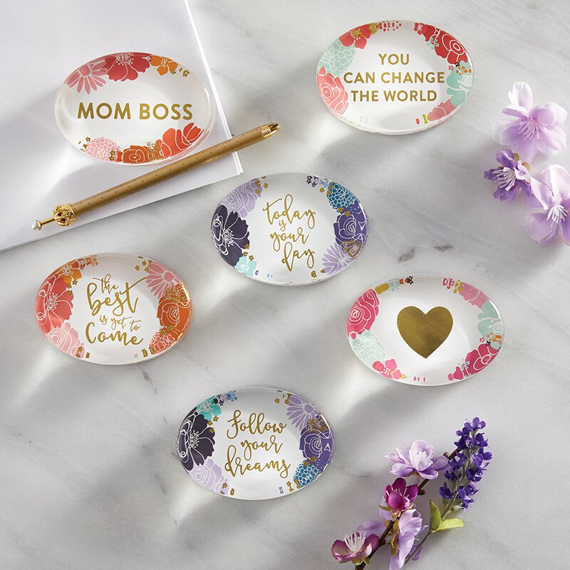 You Can Change The World glass paperweight with floral design and gold accents, featuring an inspirational message.