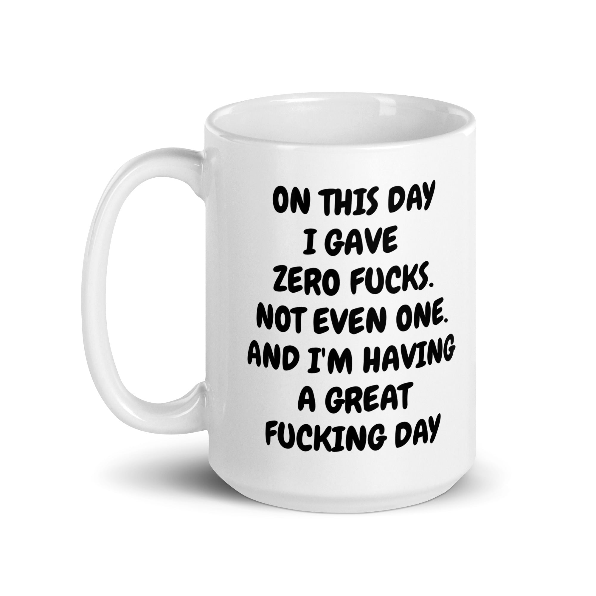 A glossy ceramic mug with a humorous 'Zero Fucks' print, available in two sizes, perfect for coffee or tea.