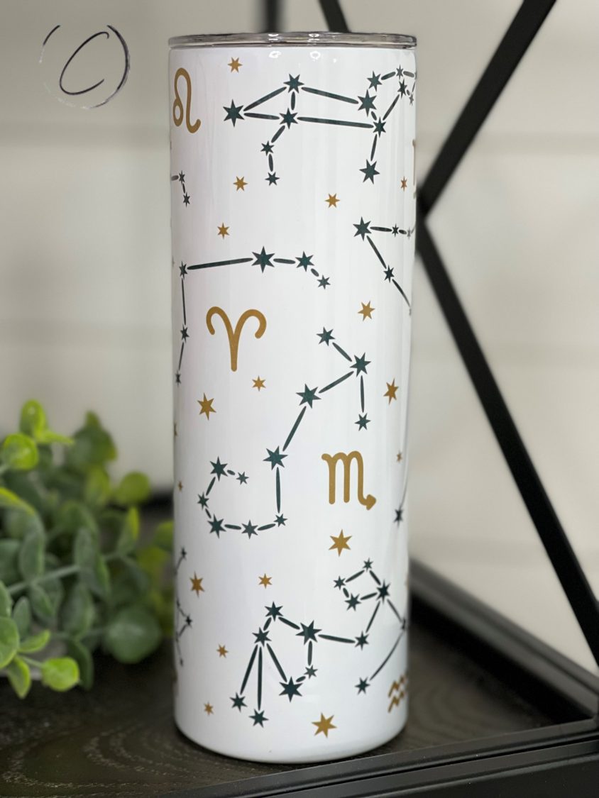 Zodiac 20oz Skinny Tumbler with integrated design, reusable straw, and sleek shape, perfect for hot and cold beverages.