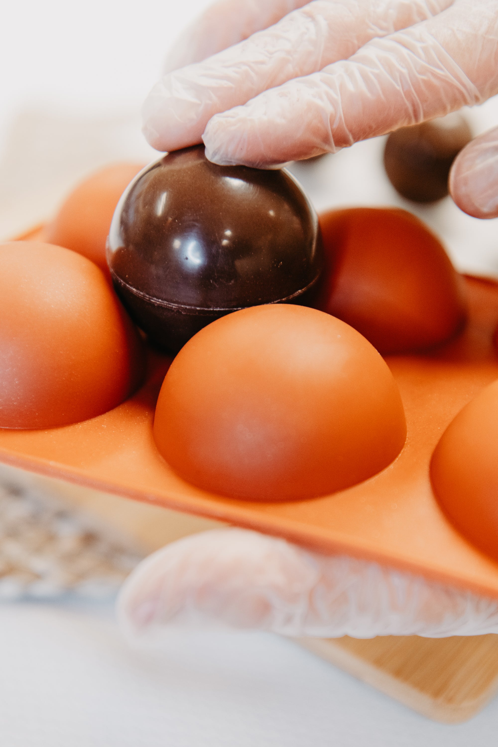 A 6 cavity silicone cocoa bomb mold with chocolate bombs, showcasing its design and functionality for making hot chocolate bombs.