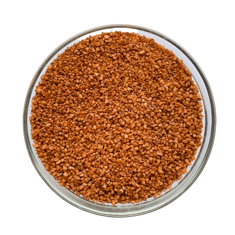 Alaea coarse salt in a glass jar, showcasing its reddish hue and natural texture, perfect for seasoning dishes.