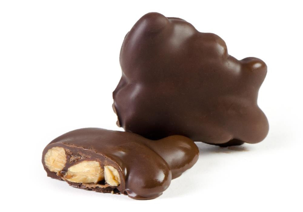 A 1-pound package of Almond Clusters featuring rich chocolate-coated almonds, perfect for snacking or gifting.