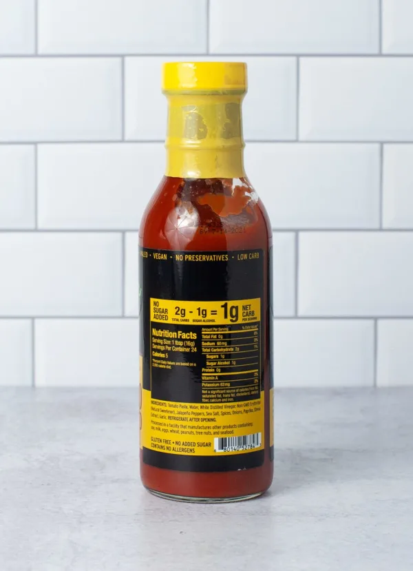 Bottle of AlternaSweets Low Carb Spicy Ketchup with a vibrant label showcasing its spicy flavor.