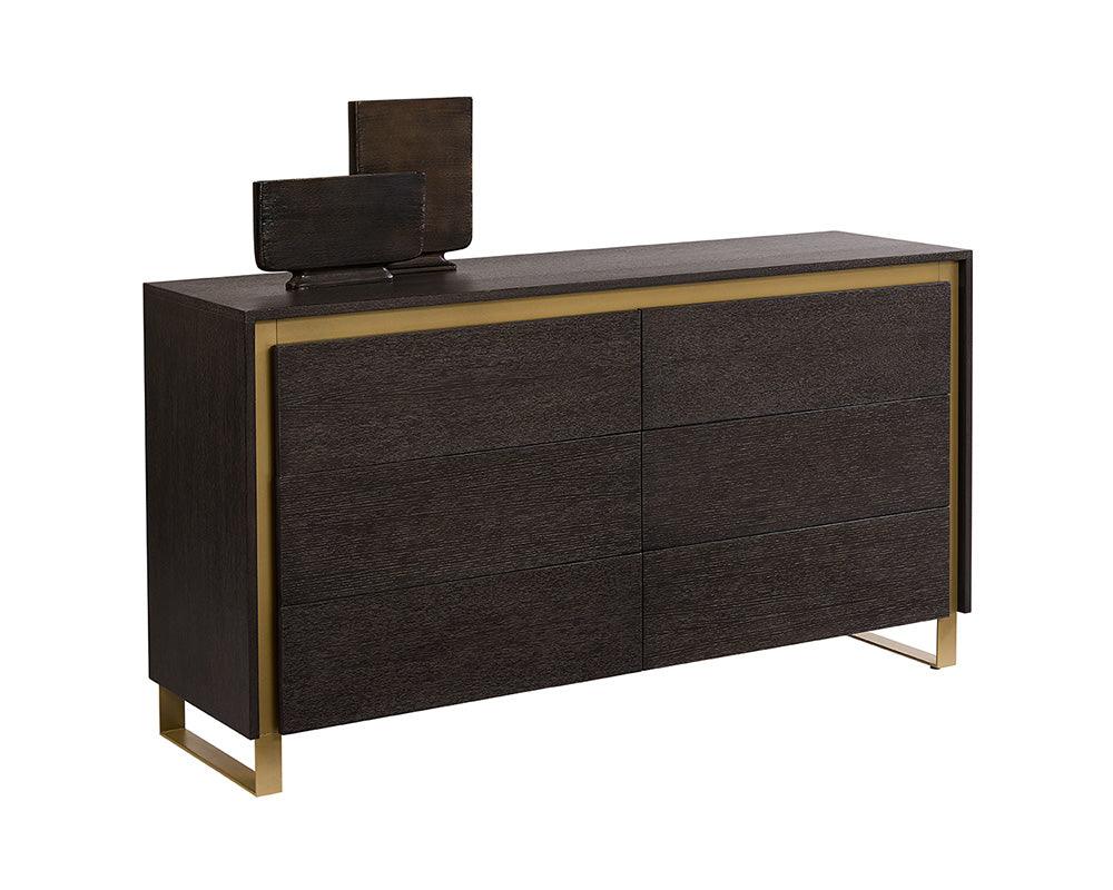 Alvaro Dresser featuring a grey finish, solid oak wood, and rustic bronze steel legs, showcasing its elegant design and spacious drawers.