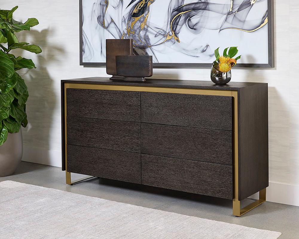 Alvaro Dresser featuring a grey finish, solid oak wood, and rustic bronze steel legs, showcasing its elegant design and spacious drawers.