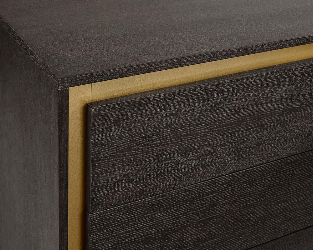 Alvaro Dresser featuring a grey finish, solid oak wood, and rustic bronze steel legs, showcasing its elegant design and spacious drawers.