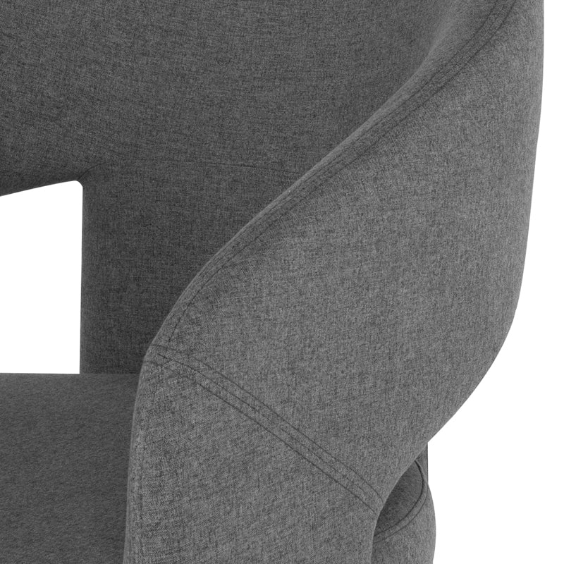 Anise Occasional Chair in shale grey with a unique three-legged design and plush fabric, showcasing its elegant curves.