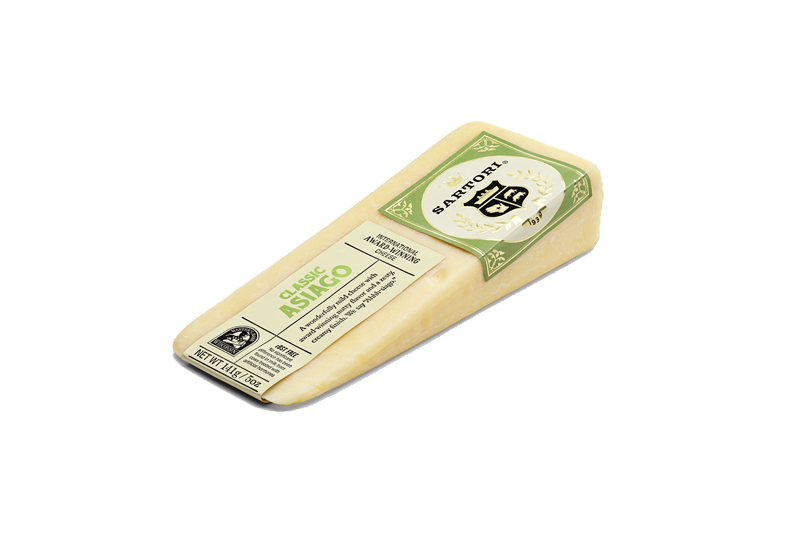 A block of Asiago cheese showcasing its semi-hard texture and rich color, perfect for grating or serving on a cheese platter.