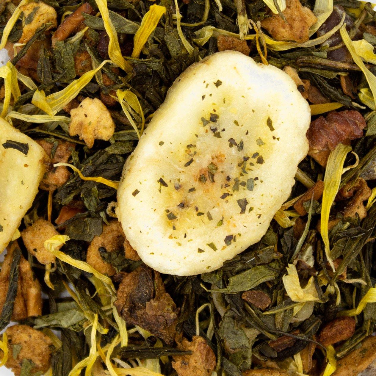 Bananapple tea blend featuring green tea, apple, banana, and natural flavors in a vibrant packaging.