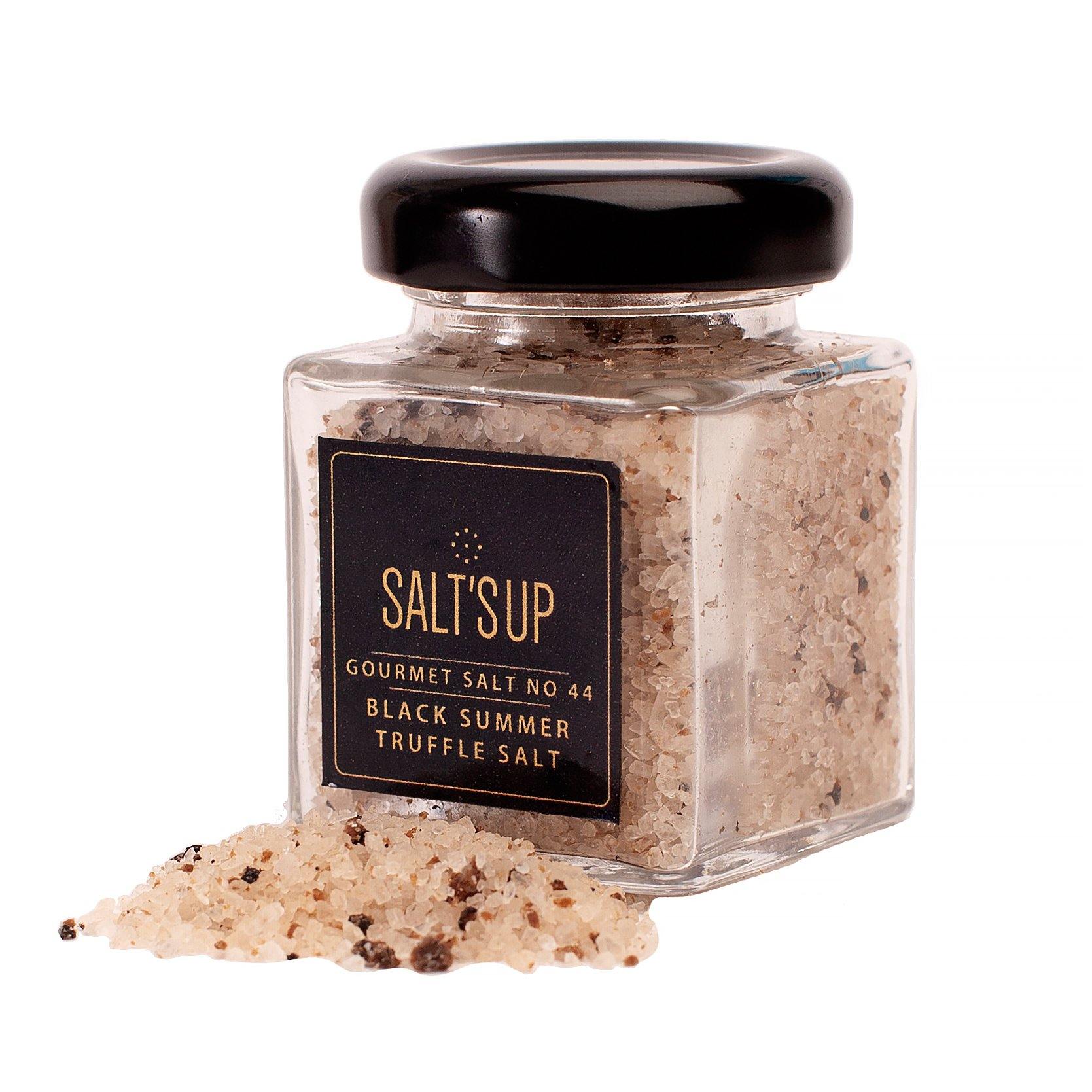 A glass jar of Black Summer Truffle salt showcasing its rich texture and truffle pieces, perfect for gourmet cooking.