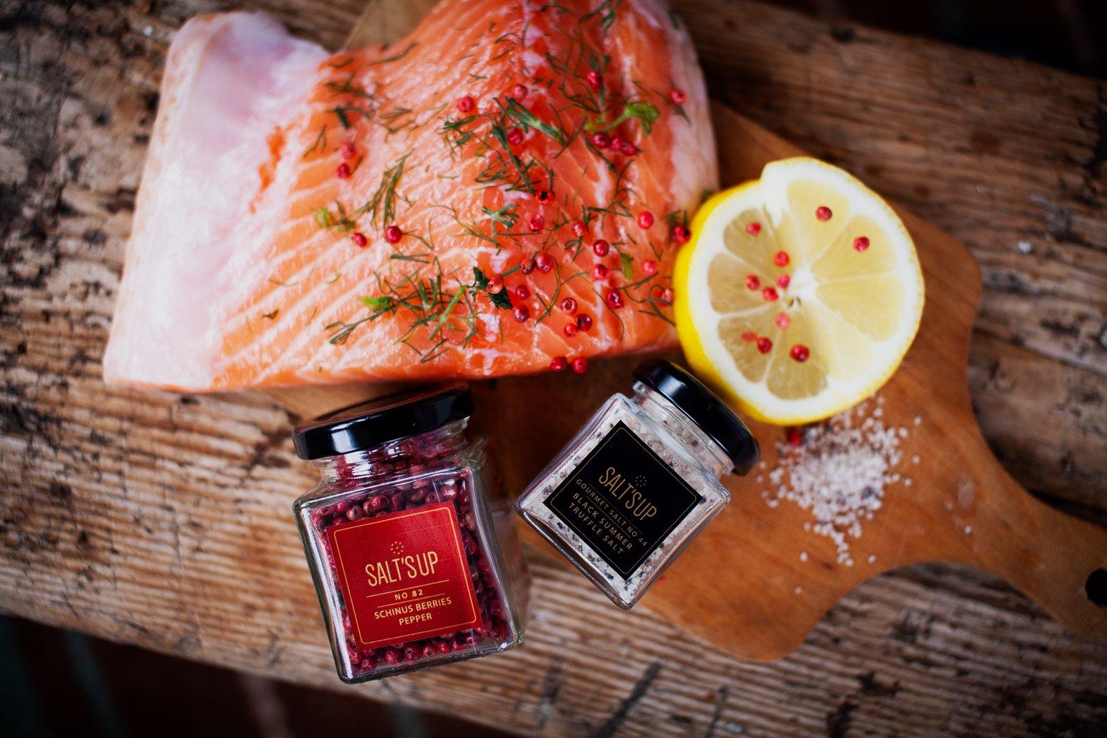 A glass jar of Black Summer Truffle salt showcasing its rich texture and truffle pieces, perfect for gourmet cooking.