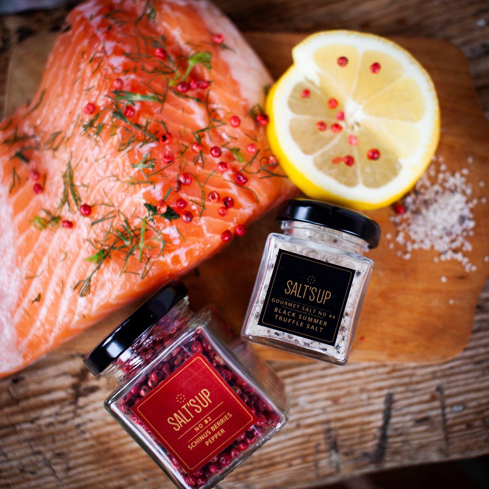 A glass jar of Black Summer Truffle salt showcasing its rich texture and truffle pieces, perfect for gourmet cooking.