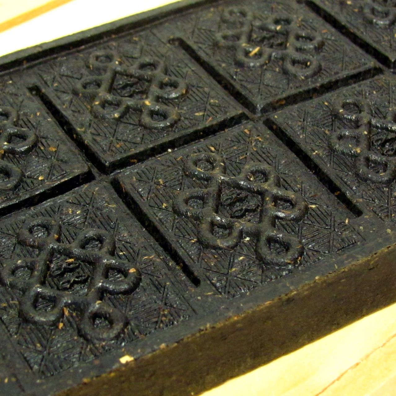 A beautifully designed Black Tea Brick featuring intricate gate patterns, ideal for brewing gourmet tea.